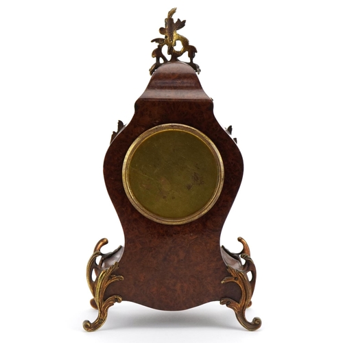 12 - 19th century French bird's eye maple cartouche shape mantle clock with ornate brass mounts having a ... 