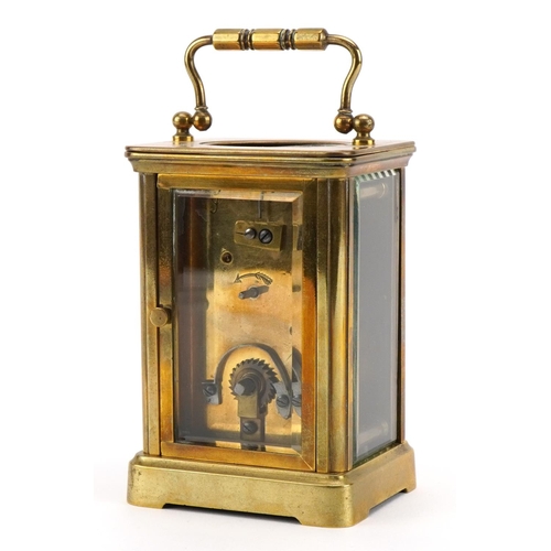 113 - French brass cased carriage clock with enamelled chapter ring having Roman numerals, 11cm high