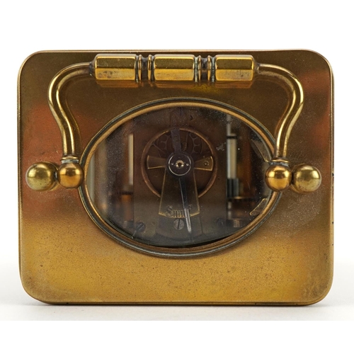 113 - French brass cased carriage clock with enamelled chapter ring having Roman numerals, 11cm high