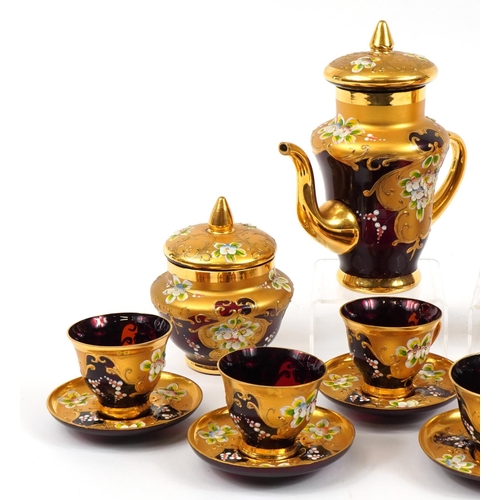 118 - Murano six place partially gilt ruby glass tea service hand painted with flowers, the largest 20.5cm... 