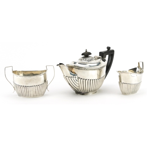 2707 - James Deakin & Sons, Victorian silver three piece tea set with demi fluted body, Sheffield 1896, the... 