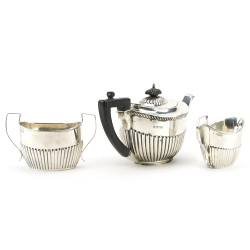 2707 - James Deakin & Sons, Victorian silver three piece tea set with demi fluted body, Sheffield 1896, the... 