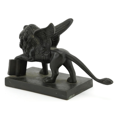 139 - Antique patinated bronze study of St Mark's Lion, 15cm in length