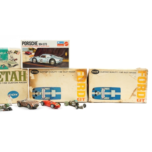 448 - Vintage motorised slot racer cars, some with boxes including Cox Ford GT, Cox Cheetah and Mattel Por... 