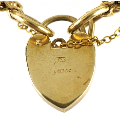 2034 - 9ct gold five row gate bracelet with love heart padlock, 18cm in length, 24.0g