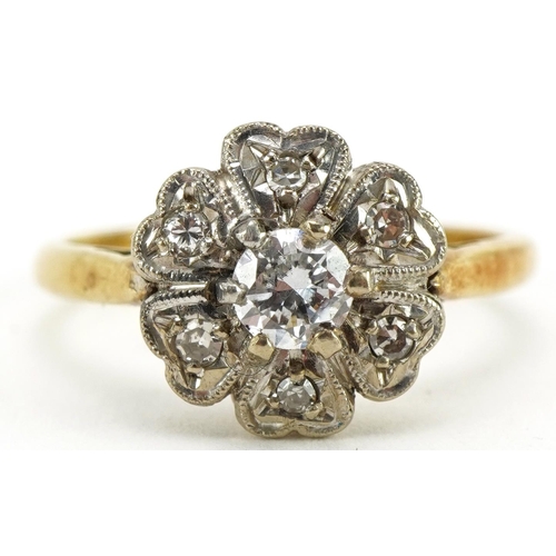 2065 - 18ct gold and platinum diamond flower head ring, the central diamond approximately 0.25ct, size M, 3... 