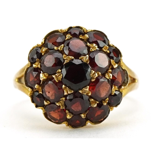 2057 - 9ct gold bohemian garnet cluster ring housed in a Bruford Eastbourne - Exeter tooled leather box, si... 