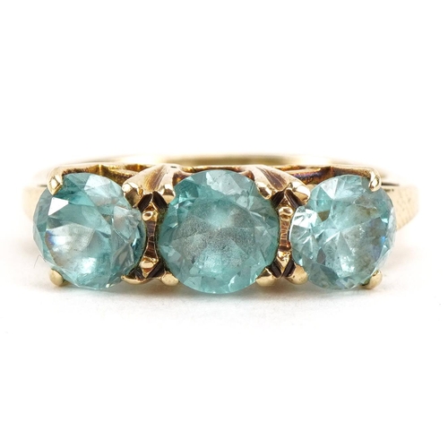 2237 - 9ct gold blue stone trilogy ring, tests as sapphire, Birmingham 1975, the largest blue stone approxi... 