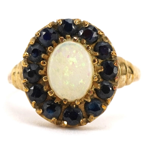 2087 - 9ct gold opal and sapphire cluster ring with stepped shoulders, the opal approximately 8.0mm x 6.1mm... 