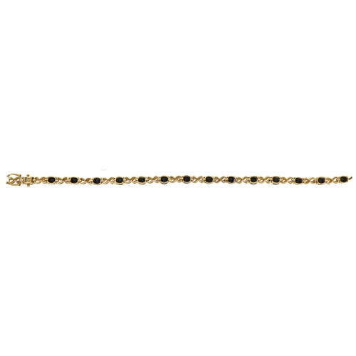 2084 - 9ct gold sapphire and diamond bracelet, 18cm in length, 8.7g