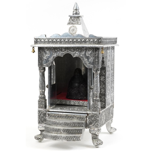 1105 - Large silvered table top Indian shrine housing a stoneware figure of Buddha, 71cm high