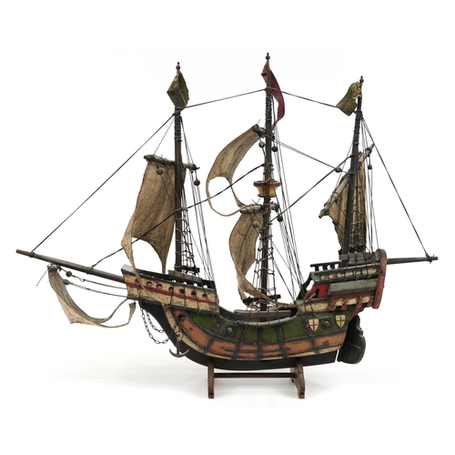 464 - Hand painted wooden model of a Tudor sailing ship, 57cm high x 72cm in length