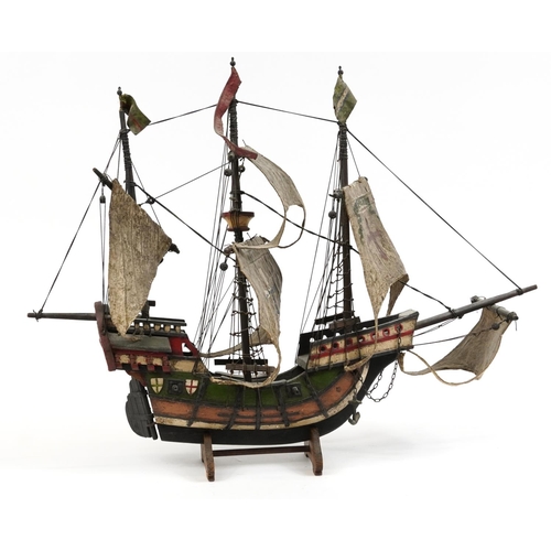 464 - Hand painted wooden model of a Tudor sailing ship, 57cm high x 72cm in length