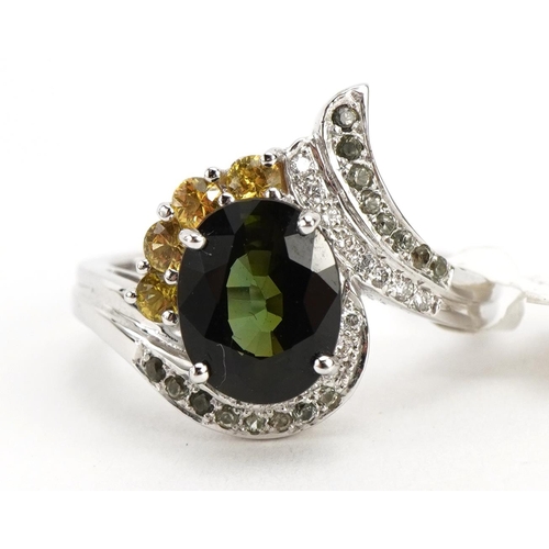 2047 - 14ct white gold green stone, yellow sapphire and diamond crossover ring, the largest green stone app... 