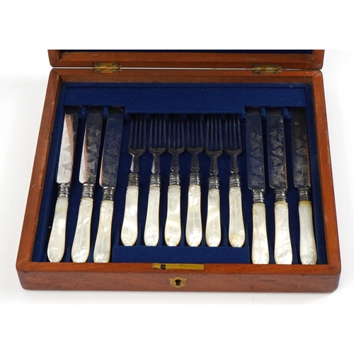 2786 - Set of six silver plated fish knives and forks with mother of pearl handles housed in a fitted mahog... 