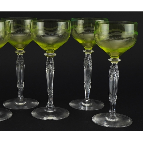 404 - Set of eight cut glass wine glasses with uranium coloured glass bowls, each 18.5cm high