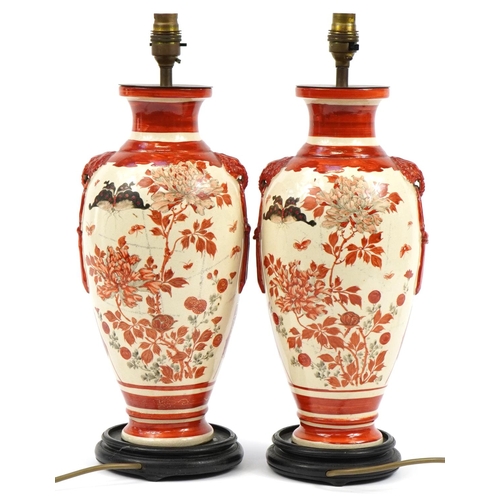 321 - Pair of Japanese Kutani vase table lamps raised on hardwood bases, hand painted with figures and but... 