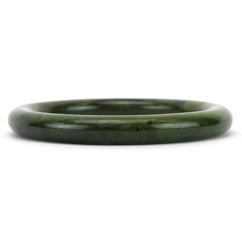 210 - Chinese green hardstone bangle, 8cm in diameter