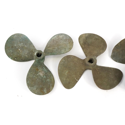 363 - Four phosphor bronze shipping interest boat propellers, the largest 32cm in diameter