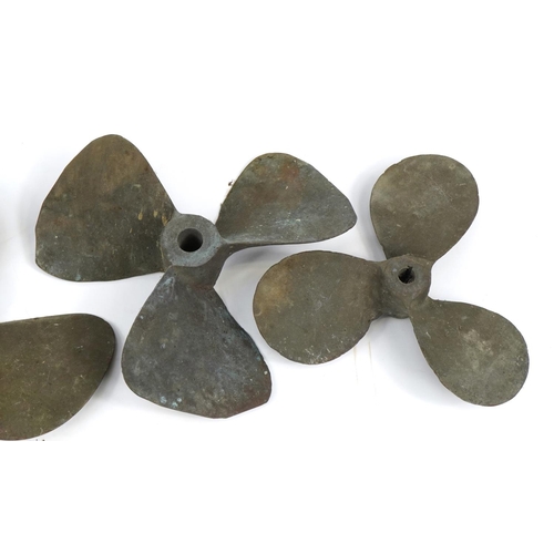 363 - Four phosphor bronze shipping interest boat propellers, the largest 32cm in diameter