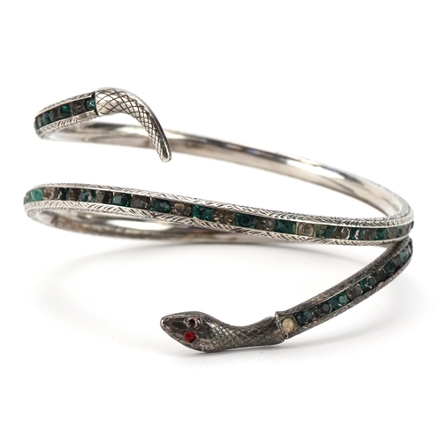 2053 - Antique sterling silver serpent bangle set with red, green and clear stones, 7cm in diameter, 24.1g