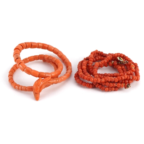 2068 - Good Chinese carved coral phoenix coil bracelet and a single strand bead necklace, total 37.1g