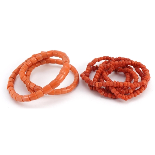 2068 - Good Chinese carved coral phoenix coil bracelet and a single strand bead necklace, total 37.1g