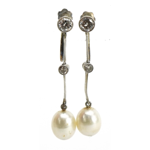 2011 - Pair of unmarked white metal diamond and pearl drop earrings with screw backs housed in a fitted too... 