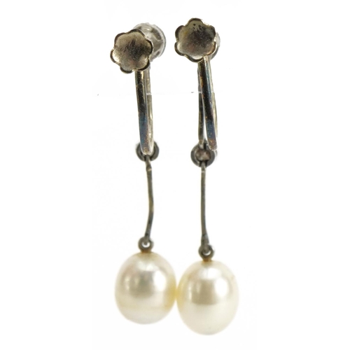 2011 - Pair of unmarked white metal diamond and pearl drop earrings with screw backs housed in a fitted too... 