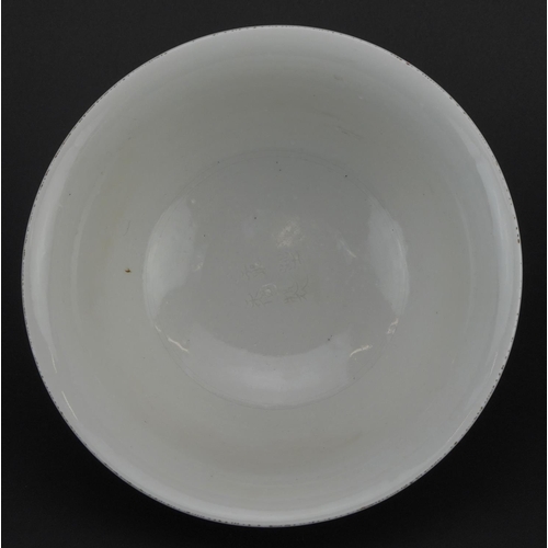 329 - Large Chinese porcelain footed bowl having a blanc de chine glaze decorated in low relief with drago... 