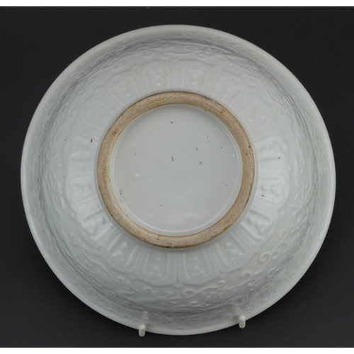 329 - Large Chinese porcelain footed bowl having a blanc de chine glaze decorated in low relief with drago... 