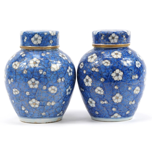 54 - Pair of Chinese blue and white porcelain ginger jars and covers hand painted with prunus flowers, ea... 