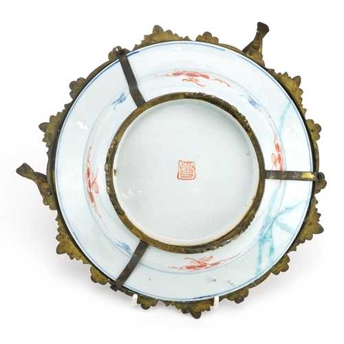 368 - Chinese porcelain soup bowl with gilt metal mounts hand painted with flowers, 25cm in diameter