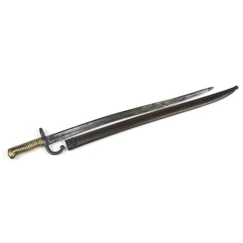 697 - French military interest long bayonet with steel blade, various impressed marks, 71cm in length