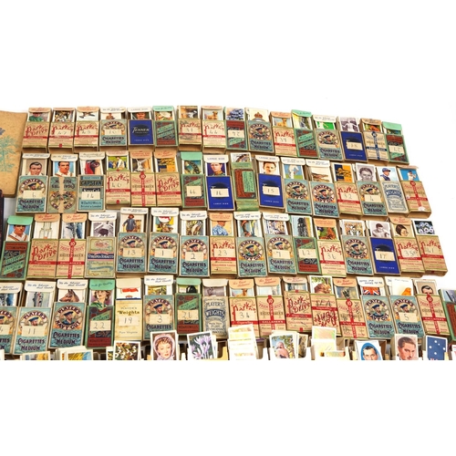 595 - Extensive collection of cigarette and tea cards, some arranged in albums including Brooke Bond Tea, ... 