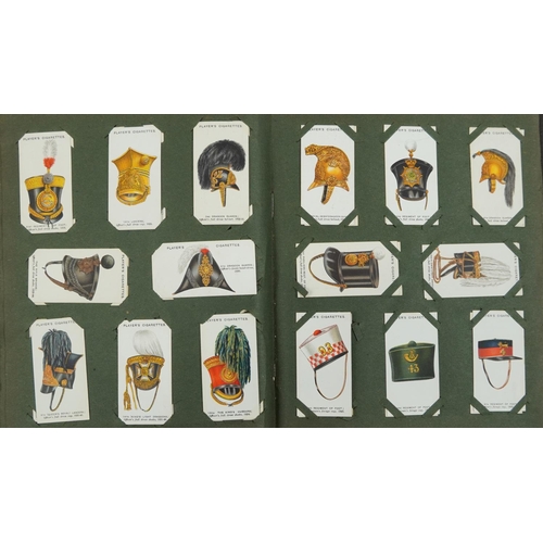 595 - Extensive collection of cigarette and tea cards, some arranged in albums including Brooke Bond Tea, ... 