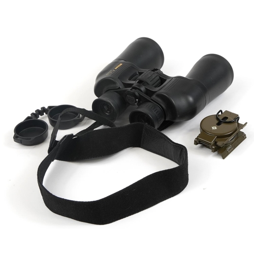 414 - Pair of Nikon Action BJ556671 binoculars with case and a pocket compass