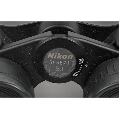 414 - Pair of Nikon Action BJ556671 binoculars with case and a pocket compass