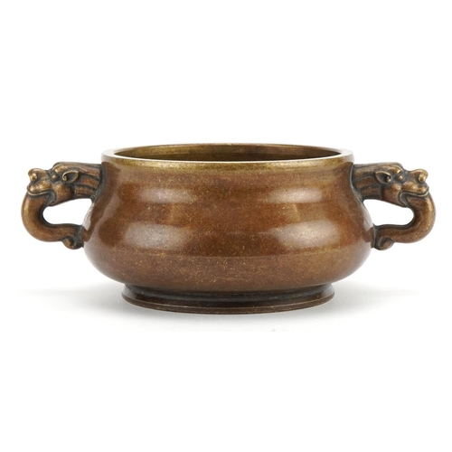 57 - Chinese patinated bronze censer with animalia twin handles, four figure character marks to the base,... 
