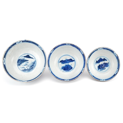 93 - Graduated set of three Chinese crackle glazed bowls hand painted with flowers and landscapes, the la... 