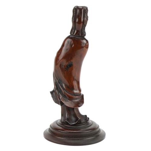 59 - Good Chinese root wood carving of an empress raised on a later circular oak base, overall 29cm high