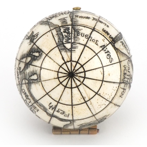 1202 - Naval interest carved bone pocket globe, 4cm in diameter