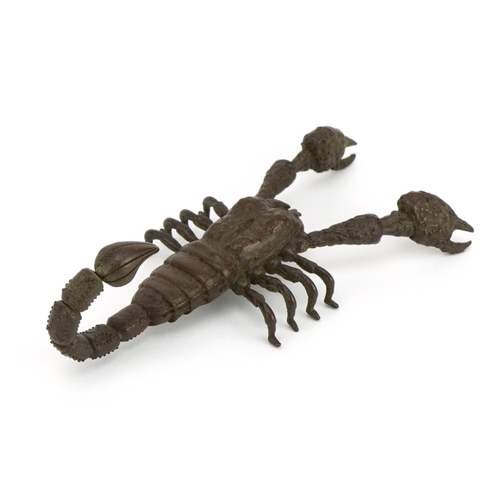 1184 - Japanese patinated bronze scorpion with articulated claws and tail, 9cm in length