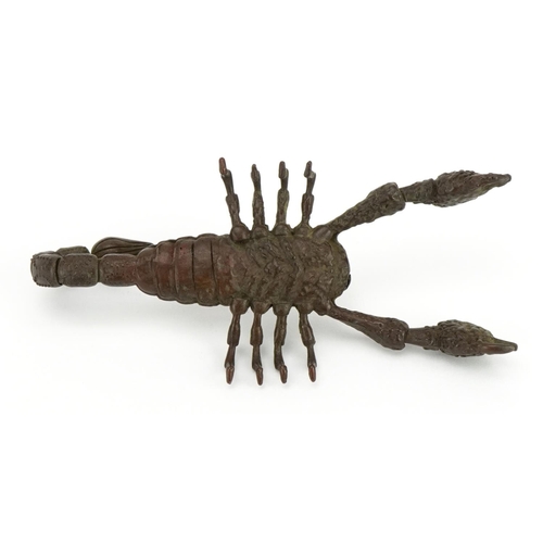 1184 - Japanese patinated bronze scorpion with articulated claws and tail, 9cm in length