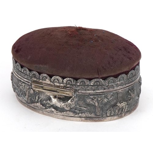 2683 - Anglo Indian unmarked silver jewel box with pincushion lid embossed with a hunter and wild game, 10.... 