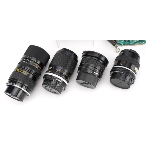 415 - Nikkormat EL camera with four lenses comprising Tamron 90mm, Tokina 17mm, Nikkor 55mm and Kikkor 35-... 