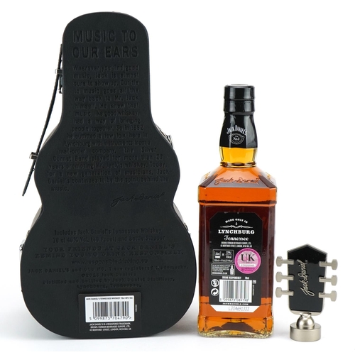 1189 - 70cl bottle of Jack Daniels whisky housed in a Music to Our Ears case in the form of a guitar, 31cm ... 