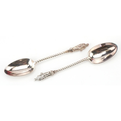 2784 - Elkington & Co Ltd, cased set of twelve silver plated apostle teaspoons with matching caddy spoon an... 