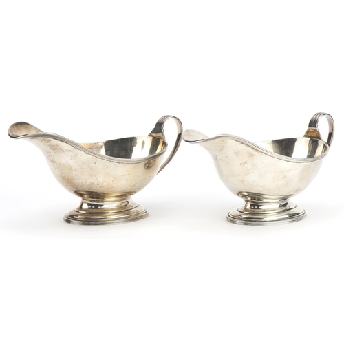 2701 - Samual Walton Smith & Co, pair of George V silver sauce boats, each 18cm wide, total 311.1g