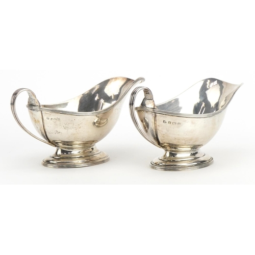 2701 - Samual Walton Smith & Co, pair of George V silver sauce boats, each 18cm wide, total 311.1g